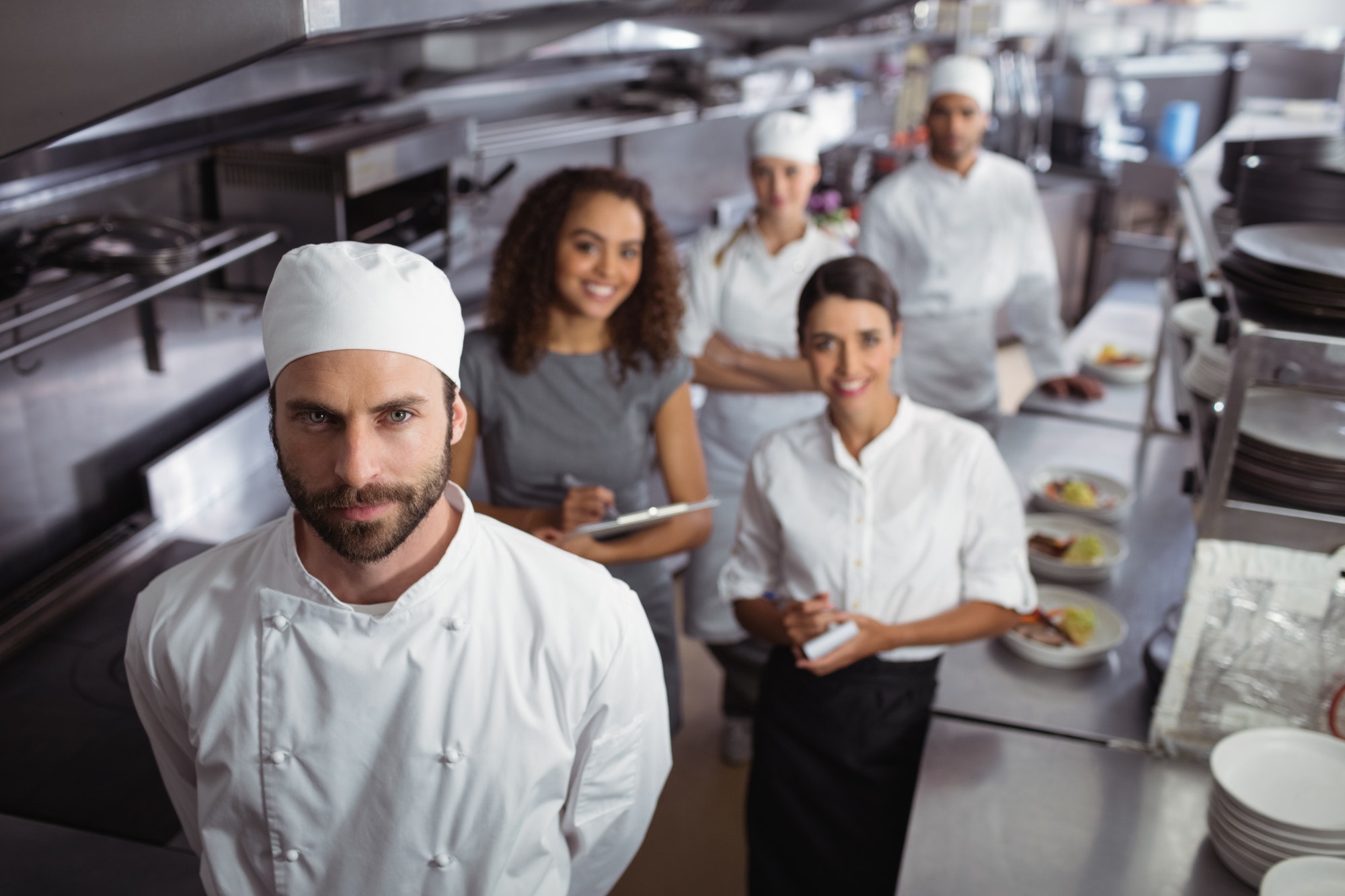 Restaurant manager with his kitchen staff